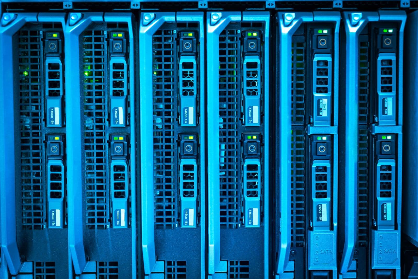 Rows of server racks lit in blue